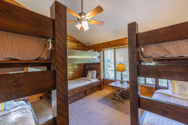 cabin bedroom with three bunkbeds