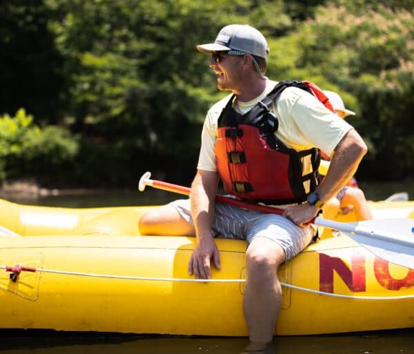 Man sit on a raft on the chattahoochee river