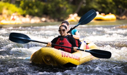 Girls on a double ducky paddling the chattahoochee river