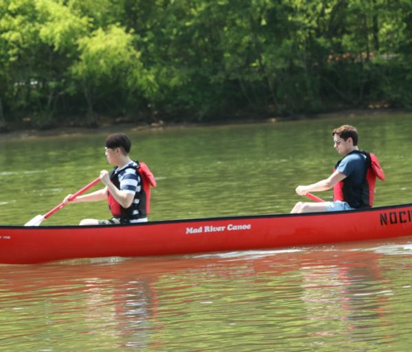 Two young men canoeing on the Chattahoochee River Canoe Rentals – Roswell trip