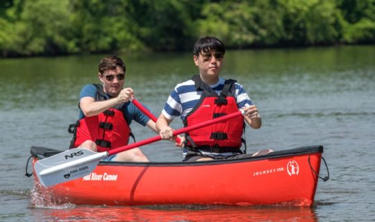 Two young men canoeing on the Chattahoochee River Canoe Rentals – Roswell trip