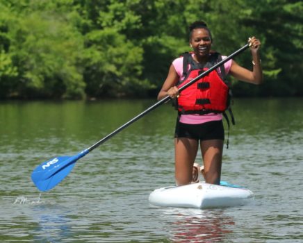 Woman stand up paddleboarding on the Chattahoochee River Stand Up Paddleboard Rentals (SUP) – Roswell trip