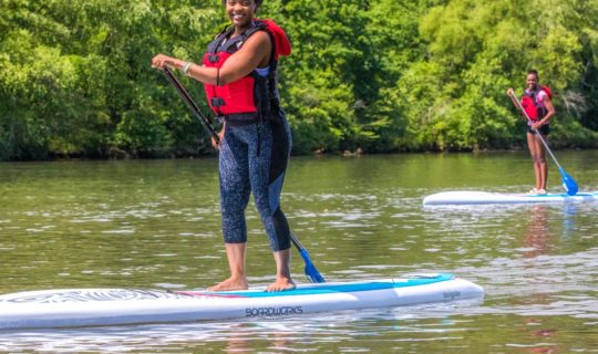 Woman stand up paddle boarding