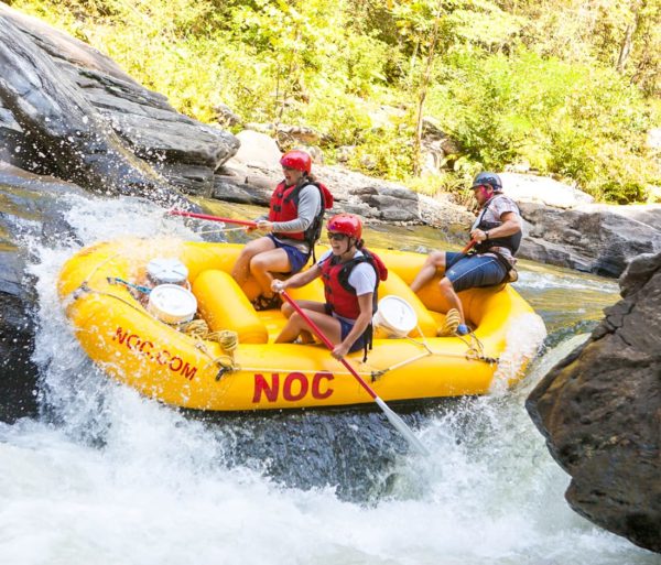 Chattooga River Rafting Class 4 Rapids down a yellow Nantahala Outdoor Center Raft.