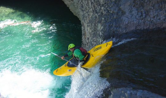 Guest kayaking down a waterfall on the Chile trip