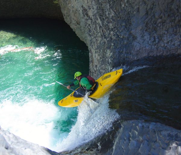 Guest kayaking down a waterfall on the Chile trip