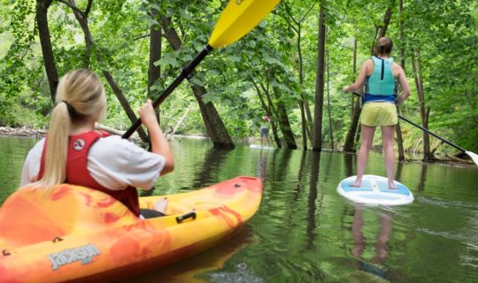 Women kayaking and SUPing on the Fontana Lake Kayak & SUP Rentals trip