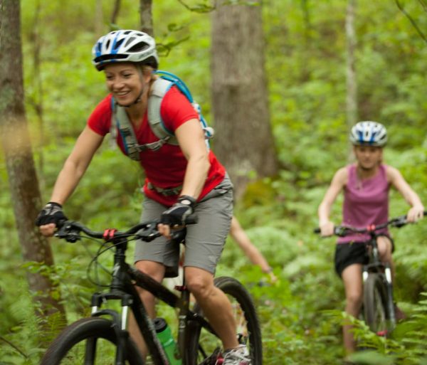 Guests biking in North Carolina on the Nantahala Adventure Pass trip