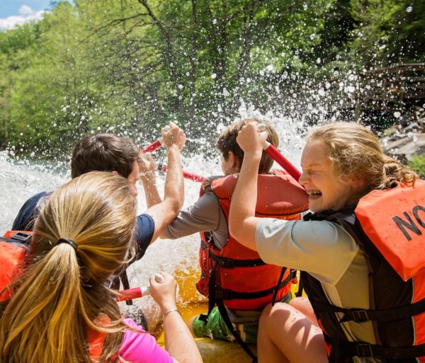 Girls getting splashed while rafting on the Nantahala River Rafting: Fully-Guided in North Carolina trip