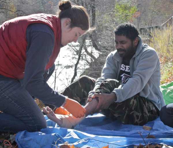 Tending to a foot injury during the Wilderness First Aid (WFA) Certification Course - Chattanooga