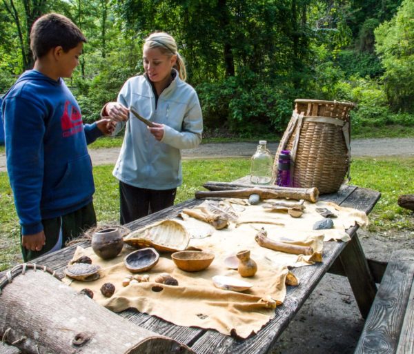 Woman showing youth survival artifacts