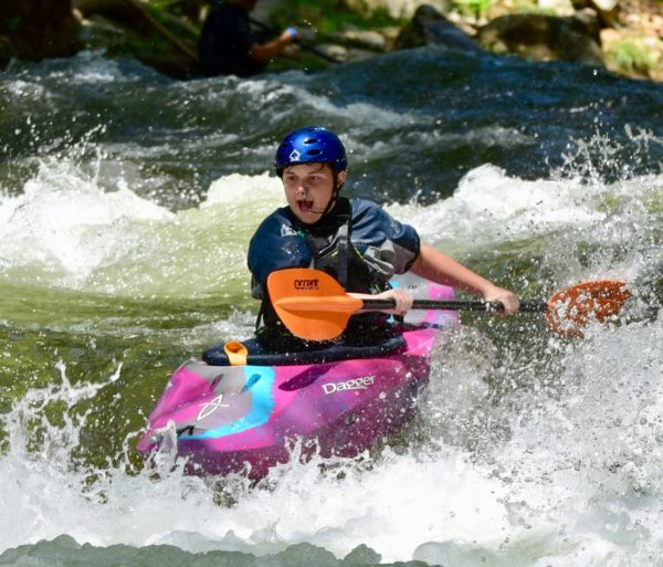 Kayaker on a river during Advanced Teen Kayak Camp