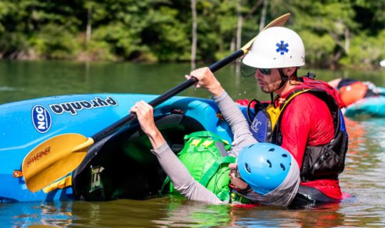 Learning to roll a kayak in paddling school