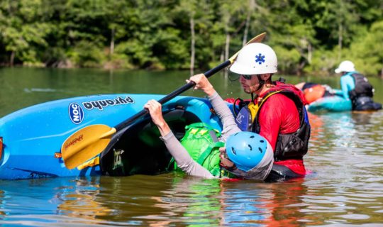 Learning to roll a kayak in paddling school