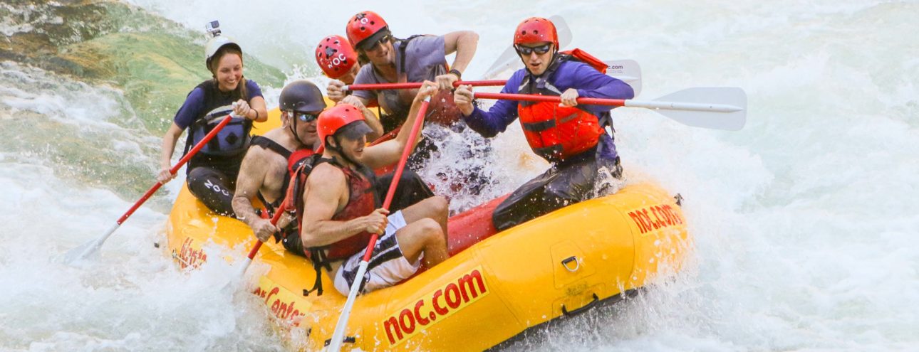 guides rafting in white water during raft guide school