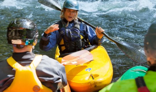 Instructor talking with guests during the Swiftwater Rescue for Whitewater Paddlers course