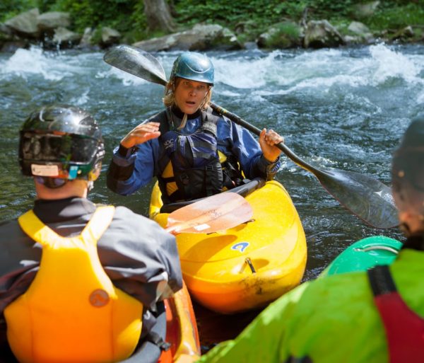 Instructor talking with guests during the Swiftwater Rescue for Whitewater Paddlers course