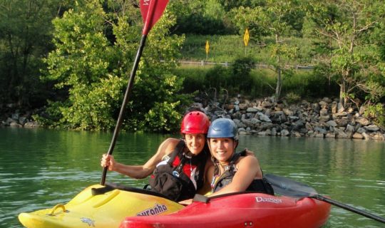 Two women in kayaks on the Women's Weekend Kayak Retreat