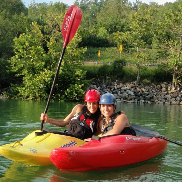 Two women in kayaks on the Women's Weekend Kayak Retreat
