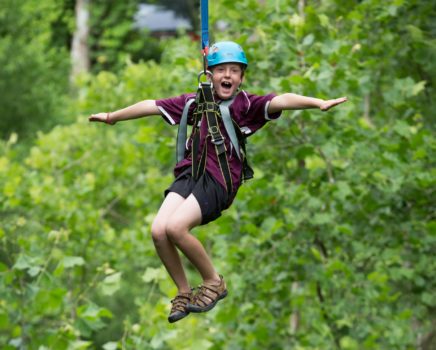 Boy zip lining