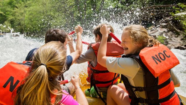 Girls getting splashed while rafting on the Nantahala River Rafting: Fully-Guided in North Carolina trip