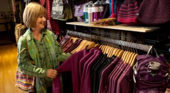 woman shopping for clothing in the noc asheville store