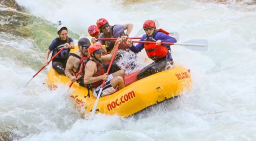 guides rafting in white water during raft guide school