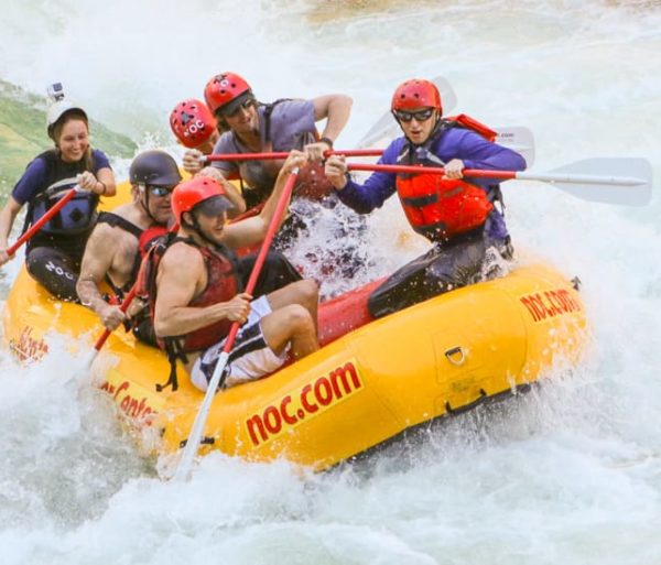 guides rafting in white water during raft guide school