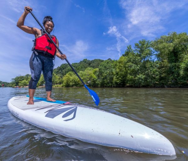 Woman stand up paddle boarding on the Chattahoochee River in Roswell, GA