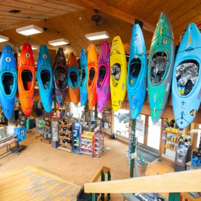 Kayaks on a wall in the NOC store