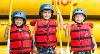 Three young rafters on the Pigeon River Rafting: Lower Pigeon Gorge trip