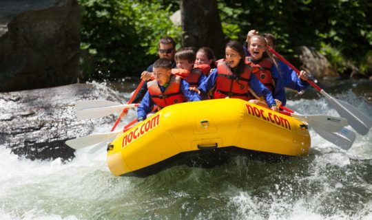 School group rafting on rapids
