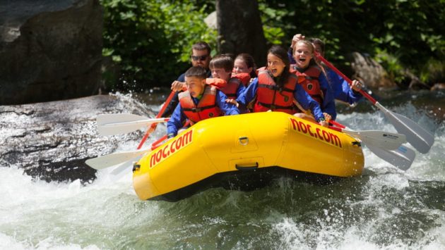 School group rafting on rapids
