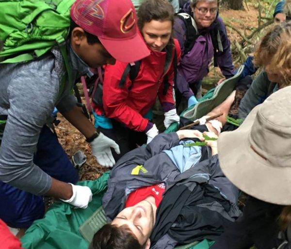 Students learning to care for person in a stretcher