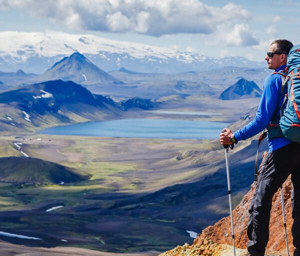 Trekker Overlooking A Mountain Valley In Southern Iceland