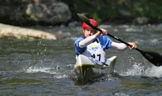 Whitewater kayaker racing