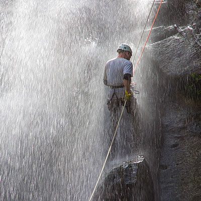 Waterfall rappelling in Ecuador