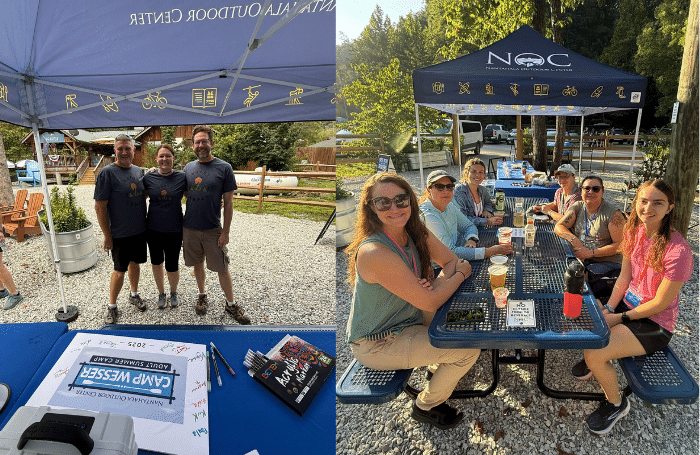 Group of adults smiling under an NOC tent and sitting together at a picnic table with drinks, enjoying time outdoors at the Nantahala Outdoor Center.