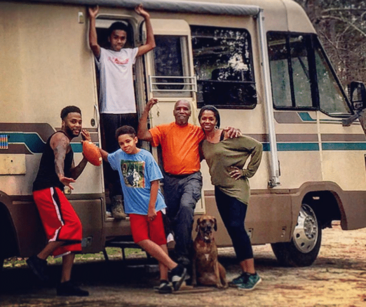 Simone camping with her family New Year's Eve 2015. Top: Her son (Aaron);  From L to R: Her brother, nephew, father, dog (Bella), and self.