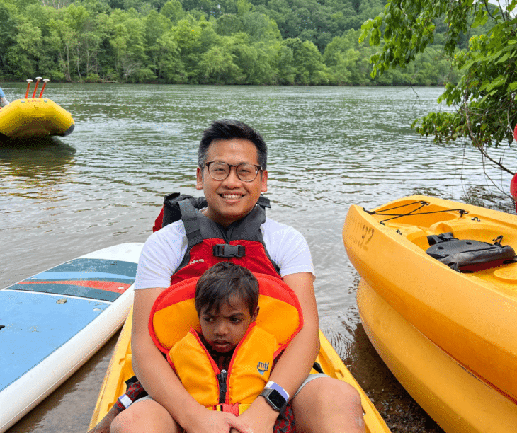 A family on their first paddling adventure during Family River Day 2023 with Color My Outdoors and Nantahala Outdoor Center, at our Chattahoochee River Outpost