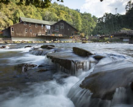 the outfitters store set back behind the nantahala river flowing