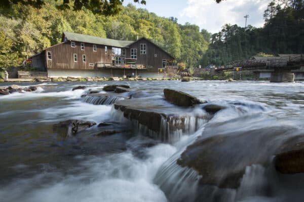 the outfitters store set back behind the nantahala river flowing