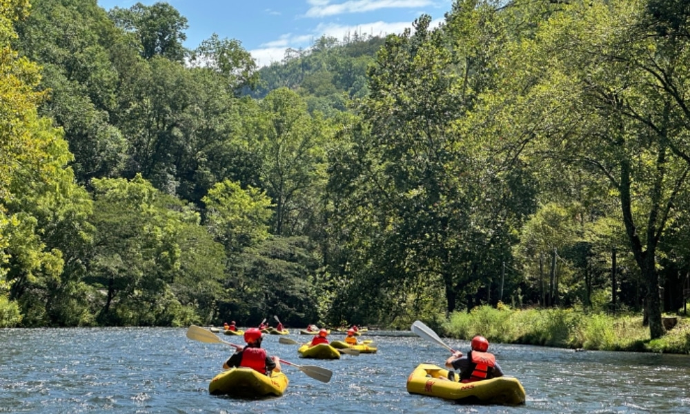 Paddlers taking on the Nantahala River in inflatable duckies.