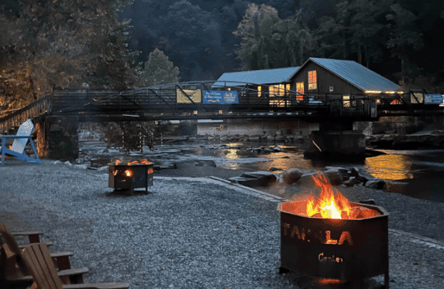 Bonfire glow by the Nantahala River at NOC in Bryson City, NC.