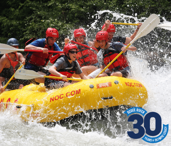 Group whitewater rafting on the Ocoee River, TN with NOC guide