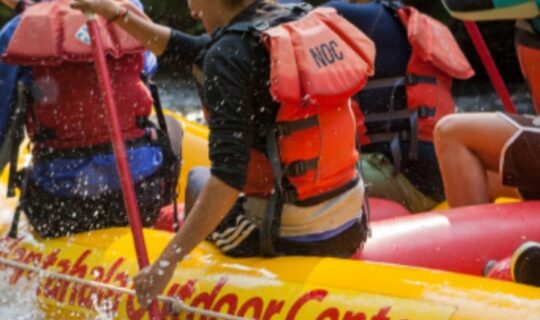 Group rafting excursion with NOC.