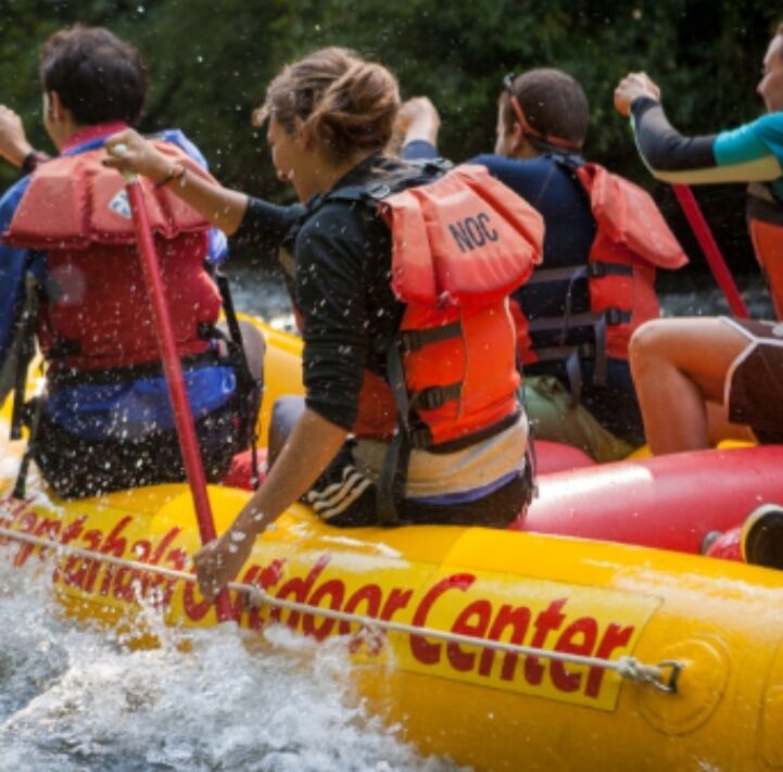 Group rafting excursion with NOC.