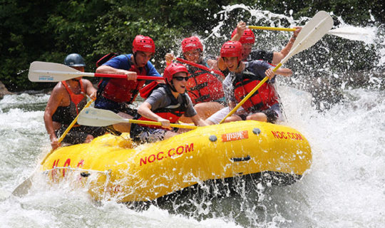 Group of people enjoying Ocoee River Rafting in beautiful Ocoee TN.